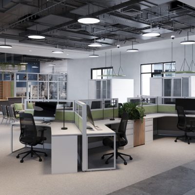 An open office work environment with several workstations, collaboration tables, and a conference space in the back of the room.